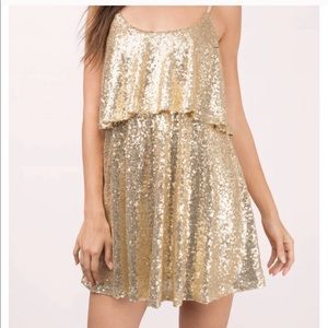 Beautiful gold sequin skater dress.